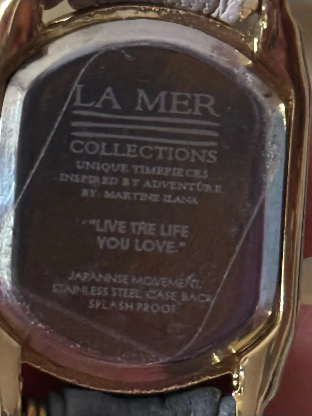 LA Mer Collections gold chain and leather wrap bracelet watch